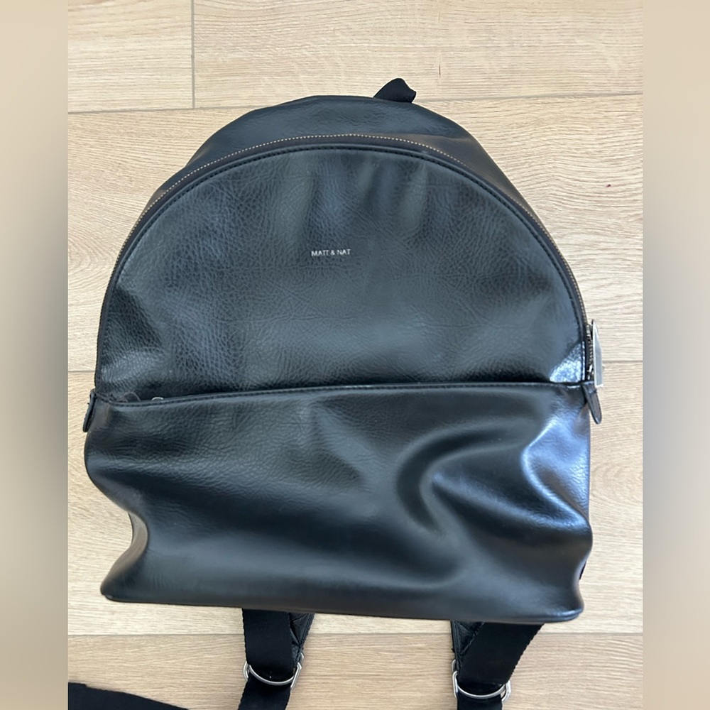 EUC black leather Matt and bat backpack
